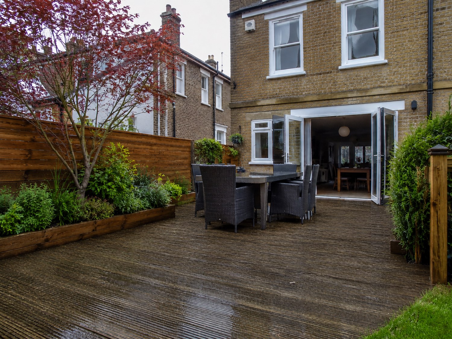 Timber decking before treatment — weathered and grey